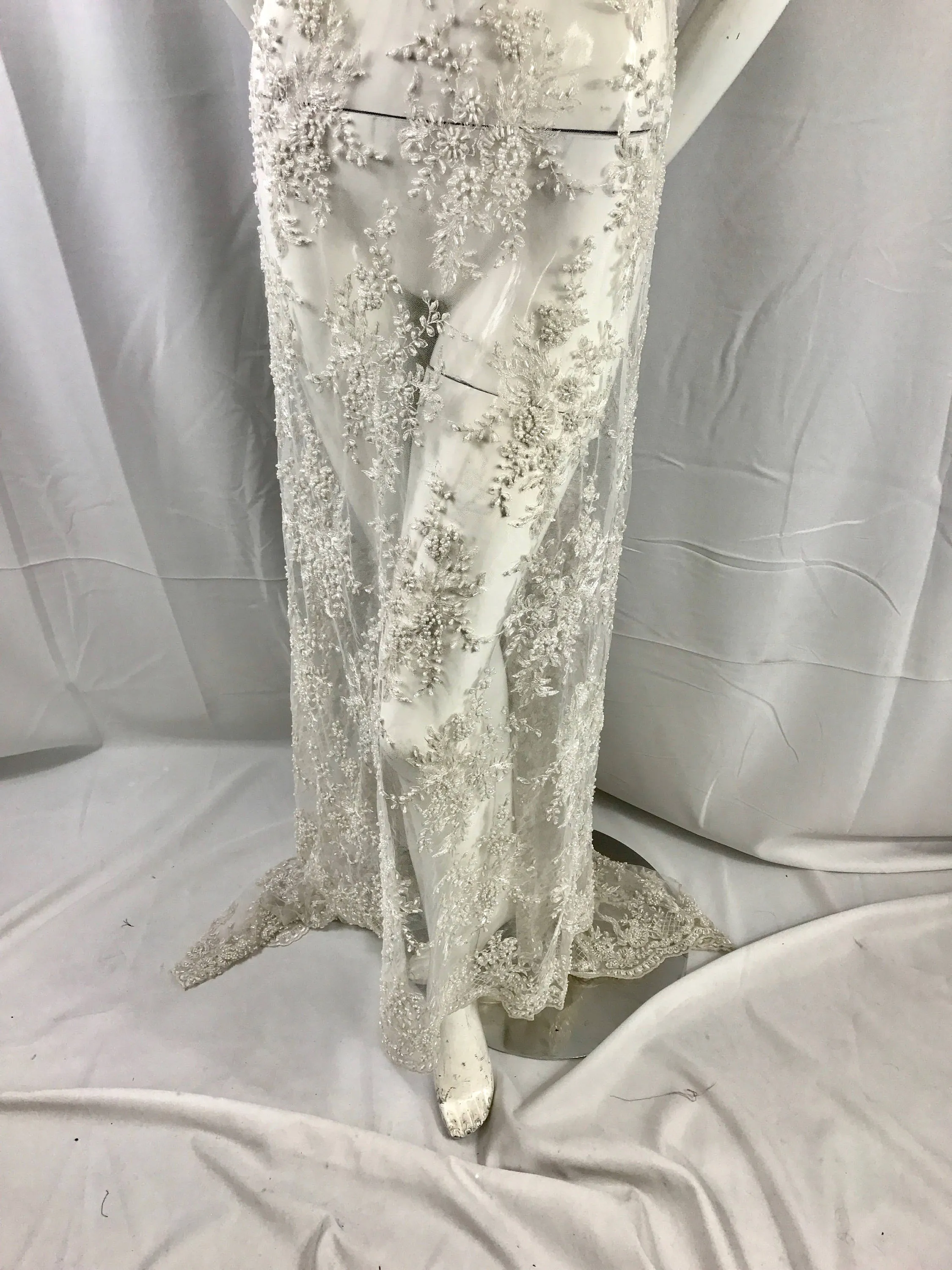 Gorgeous off white French design embroider and beaded on a mesh lace. Wedding/Bridal/Prom/Nightgown/dresses/fashion/sold by the yard.